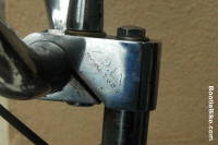 close up of handlebar clamp showing brand name