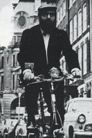 period photo of reyner banham of moulton bike